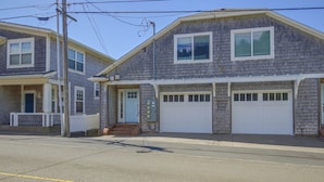 A two-story residential building with a garage and a covered porch. - Direct Beach Access, 2 Mi to Chinook Winds Casino (Lincoln City)