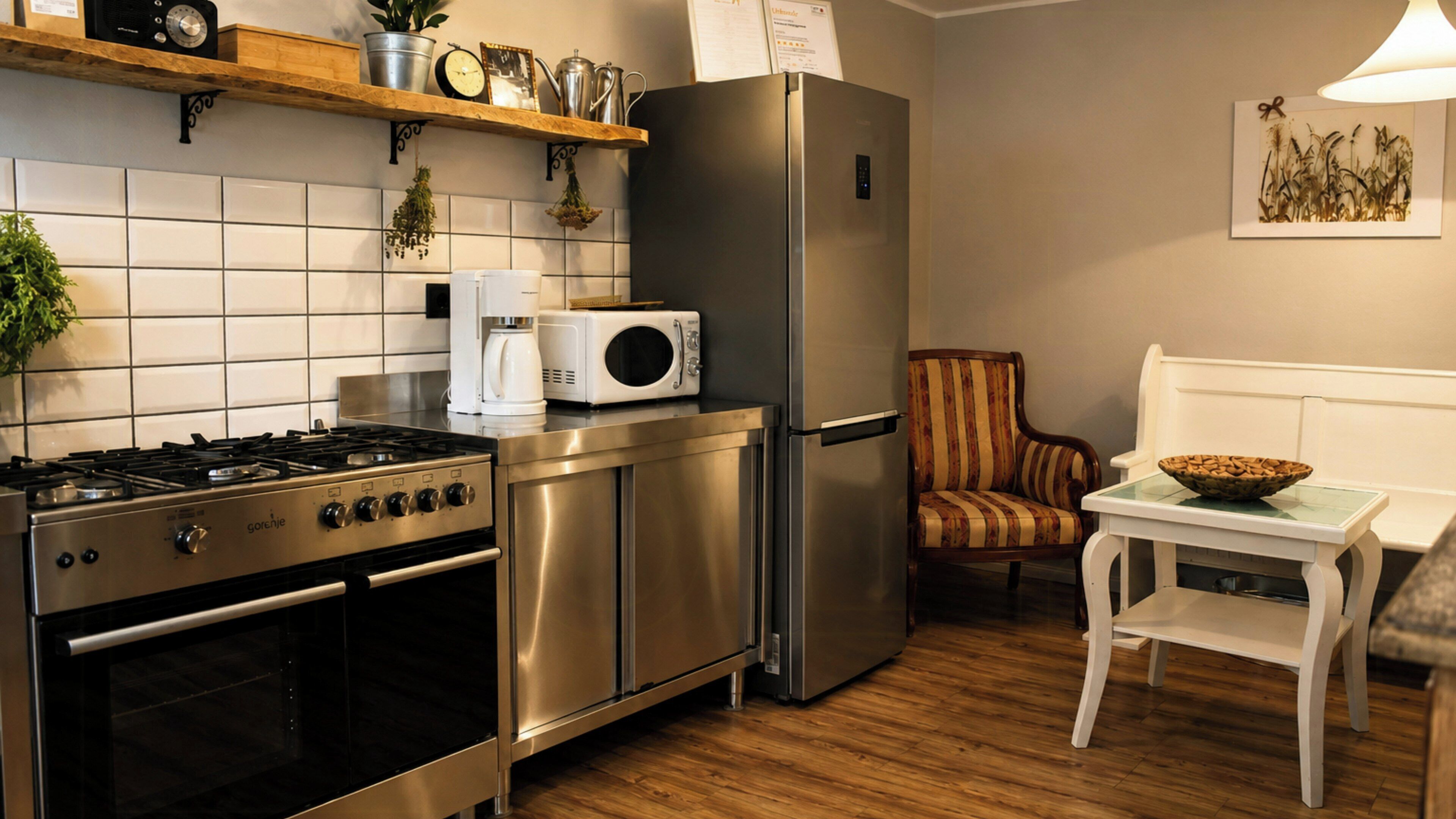A modern kitchen with stainless steel appliances, a coffee maker, and a microwave.