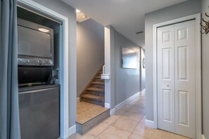 A kitchen with a built-in oven and a staircase leading to another level. - New Listing! Upscale 3 Bedroom townhome in Little Harbor Resort, 2 onsite Restaurants | Heated Pools (Ruskin)