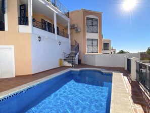 A two-story building with a swimming pool, outdoor staircase, and balconies. - Villa Lucena Private Pool by Casasol by Interhome (Nerja)