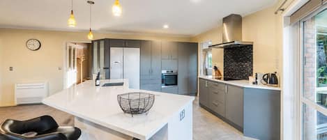 Coffee/tea maker, fridge, microwave, oven