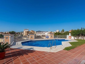 A swimming pool with a view of buildings in the background. - Fuentesol 15 Casa Lindblad by Casasol by Interhome (Nerja)
