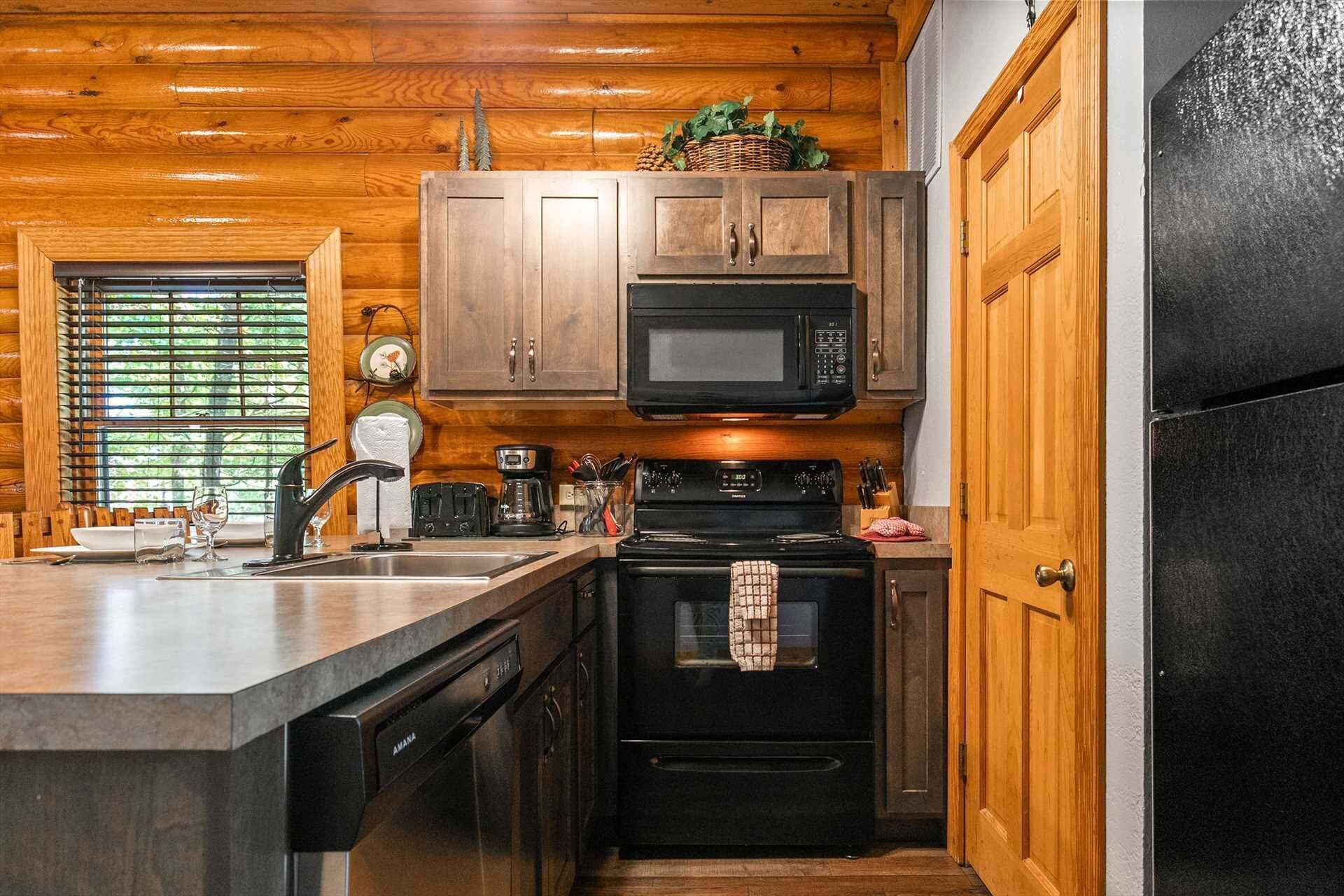 A kitchen with wooden cabinets, a microwave, a stove, and a dishwasher.