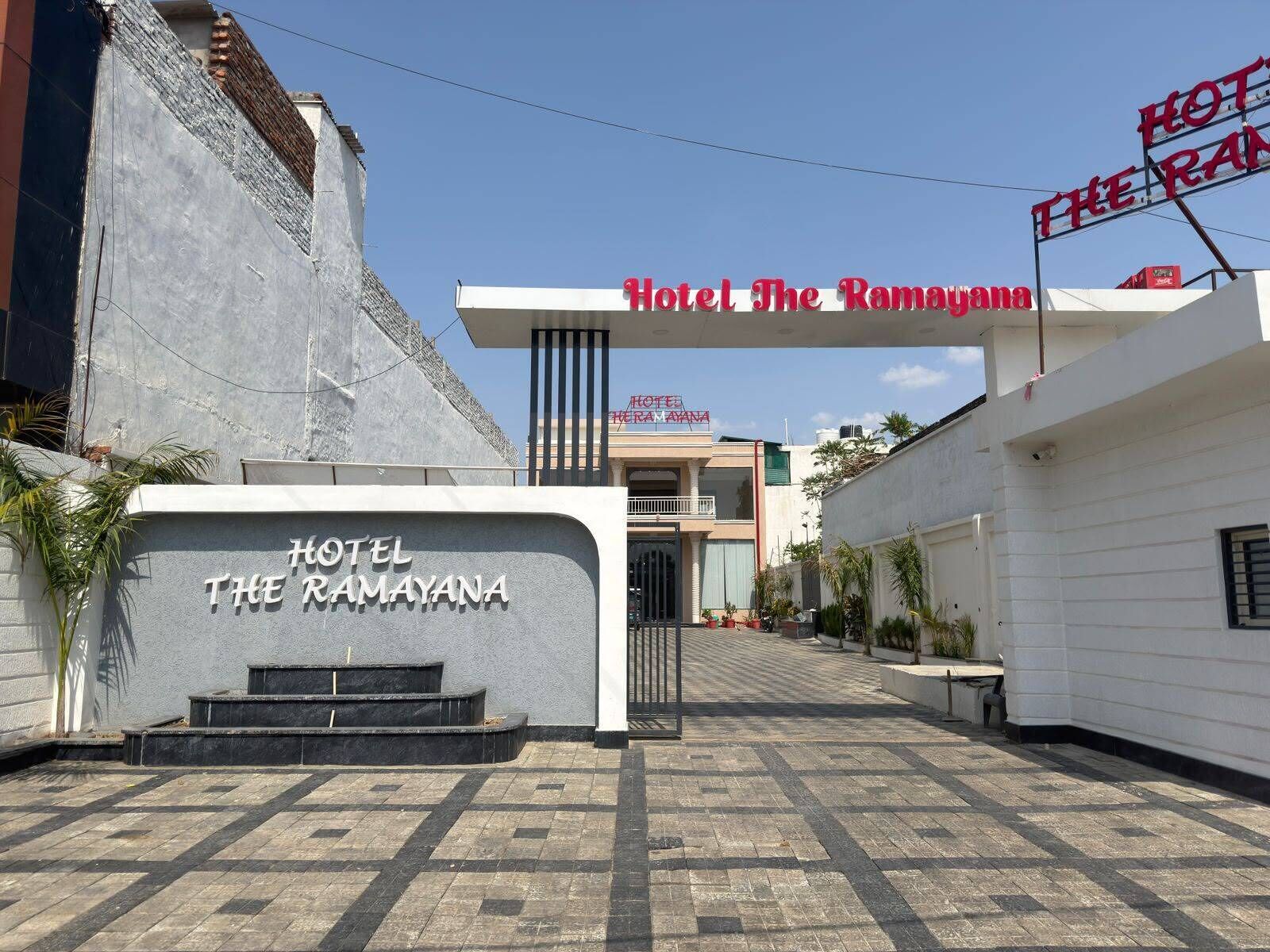 Hotel The Ramayana with a clear entrance, a signboard, and a paved walkway.