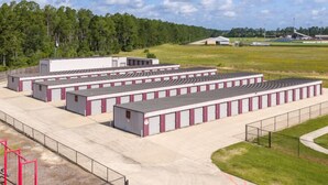 A large industrial-style building with multiple storage units. - Saddlebrook: Comfortable Furnished Apartment (Lumberton)