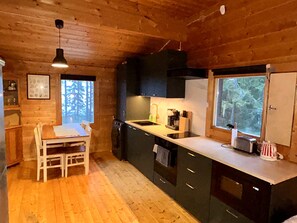 Private kitchen - Log cabin by the lake in Finland: 2 wooden saunas, hot tub, private beach (Pohjois-Savo)