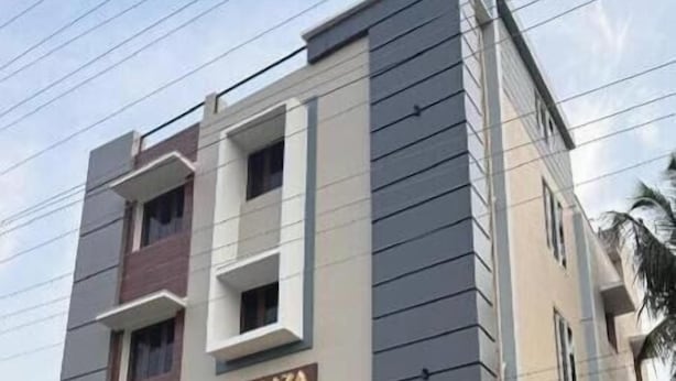 A multi-story building with a sign reading 'KIA PLAZA'.