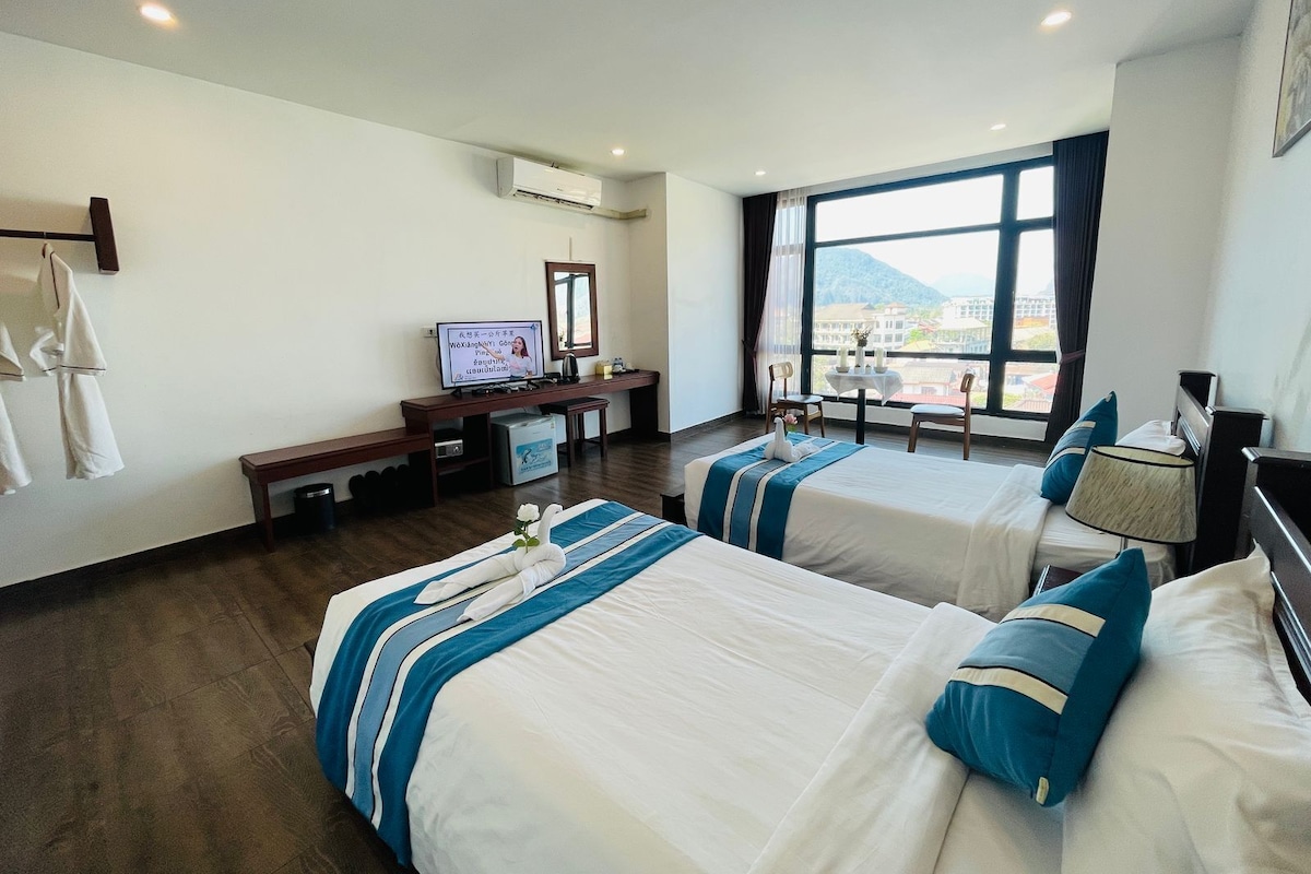 Chambre Deluxe Double ou avec lits jumeaux, vue ville | Literie hypoallergénique, surmatelas, coffres-forts dans les chambres
