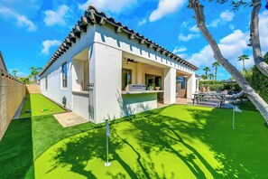 A modern house with a patio, a barbecue area, and a pool. - All Inclusive- Nine Cities One Oasis/Game Room (Indio)