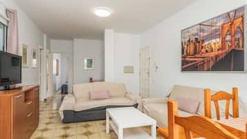 Superior Apartment, Balcony, City View | Living area | Flat-screen TV
