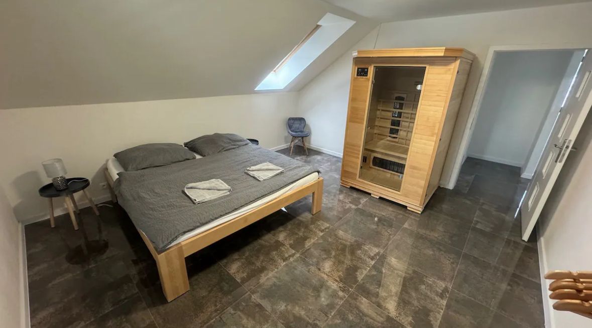Spacious loft bedroom with private in-room sauna and skylight