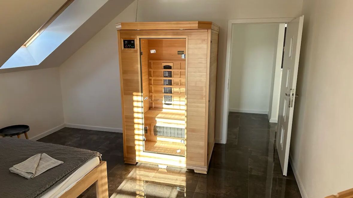 Bright bedroom with private sauna and skylight for a relaxing retreat