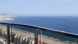 A coastal cityscape with a beach, buildings, and a clear sky. - SUNSET SAILORS cozy apartment (Benidorm)