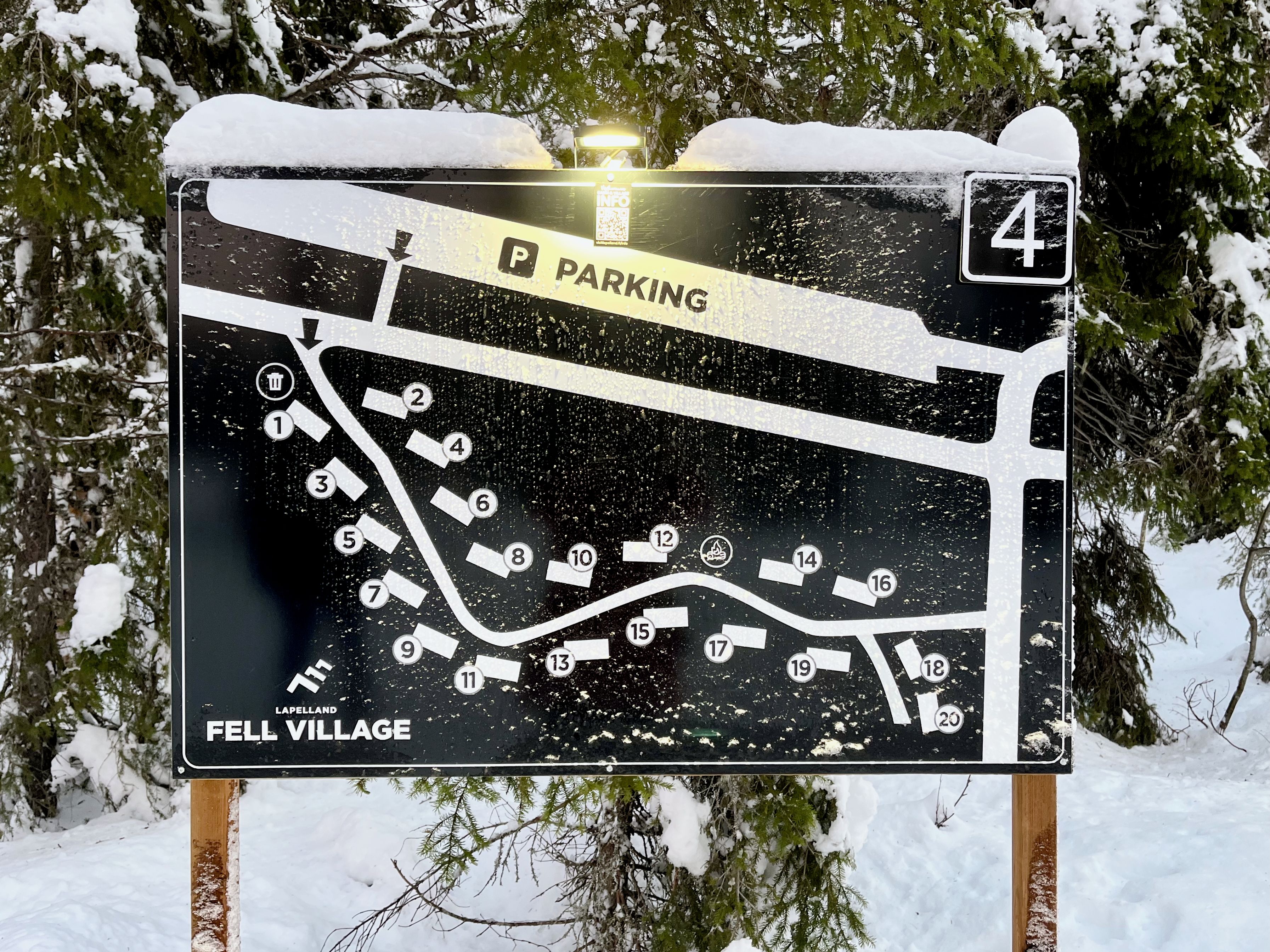 A parking sign with numbered parking spaces and a 'PARKING' label.