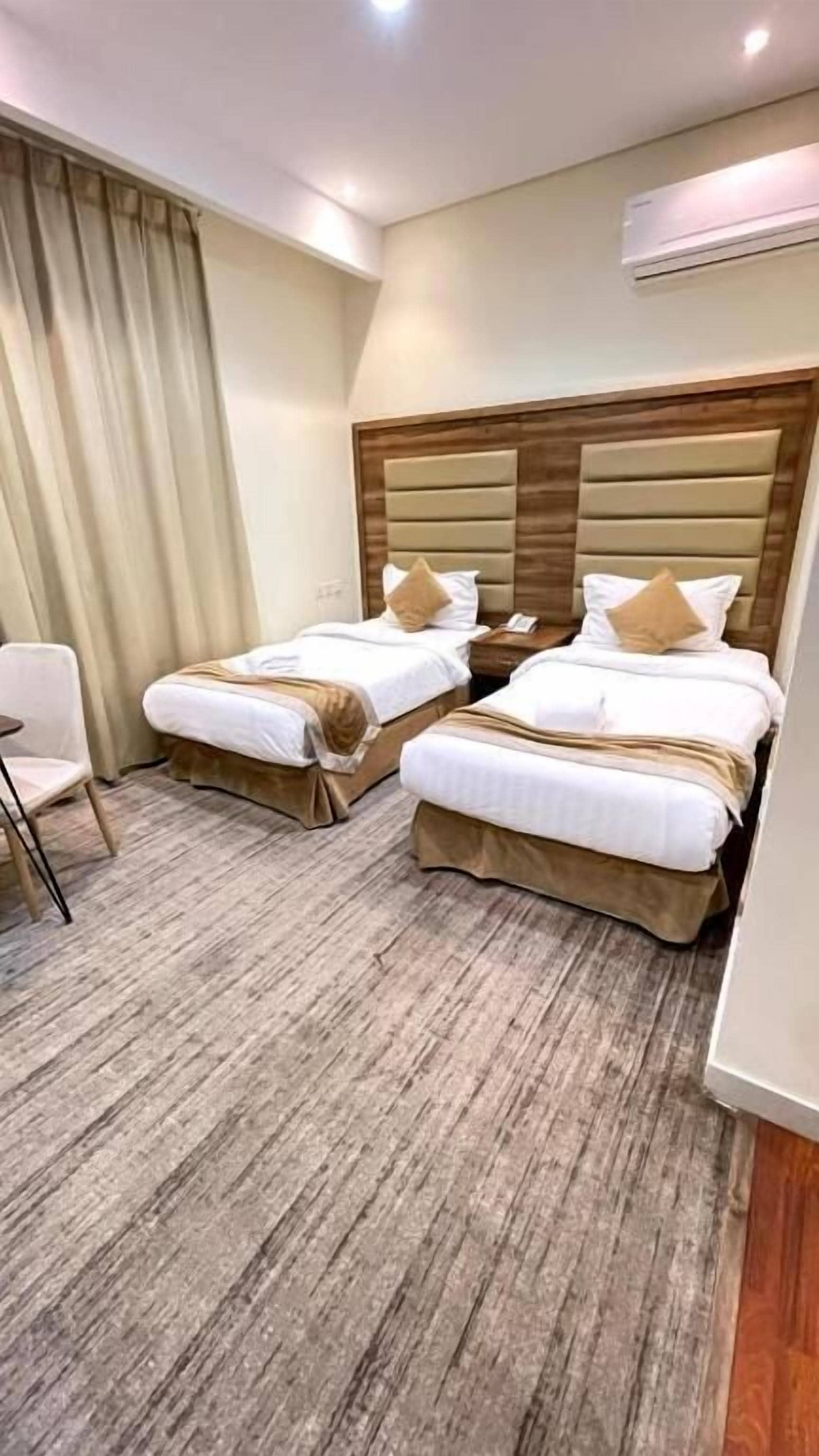 Twin Room | Blackout drapes, iron/ironing board (on request), WiFi (free)