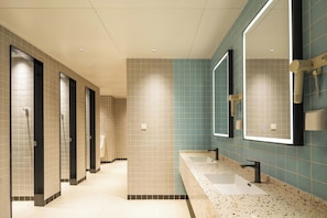 A hotel bathroom with multiple sinks, a mirror, and a tiled floor. - Shanghai Zhuxiaoman Urban Hostel (Shanghai)