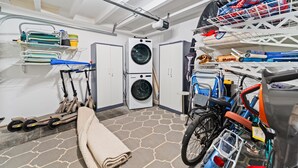 A laundry room with a washing machine, dryers, and a folding station. - Perfect 4 Families, Walk To Beach, Roof-Top Patio! (Oxnard)