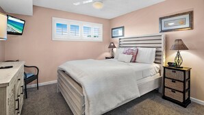 A bedroom with a bed, a desk, a chair, a lamp, and a wall-mounted TV. - 🌊Walk 2 Beach~2 Pools~Beautiful Views~2BR The Islander 314 🌊 (Destin)