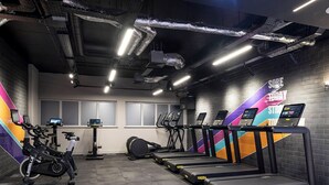 A gym with treadmills, stationary bikes, and a rowing machine. - Student Only Bridle Works (Glasgow)