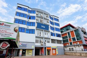 A multi-story building with a blue sign reading 'Via' on the facade. - Via Anasuya (Bhubaneshwar)