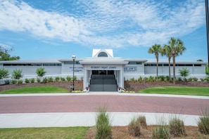 A modern building with a sign for Robert Trent Jones and Big Jim's. - 2BR Condo for 6 w Patio & Resort Pool, Near Beach! (Hilton Head Island)