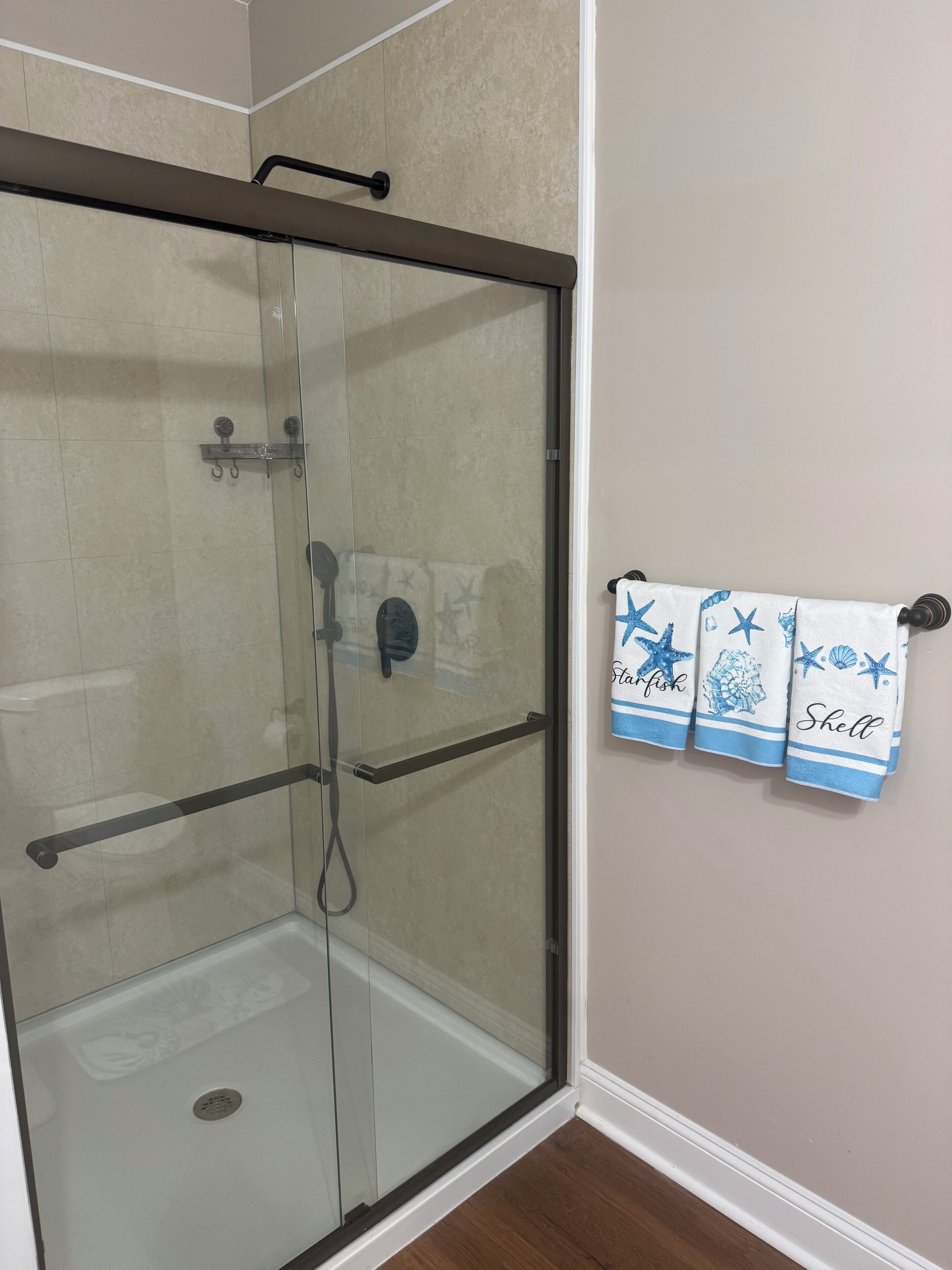 View of walk in shower