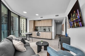 A modern apartment with a kitchen, dining area, and living room. - 2 Apts for 8 · 2BR/2BA, Rooftop Pool, Downtown MIA (Miami)