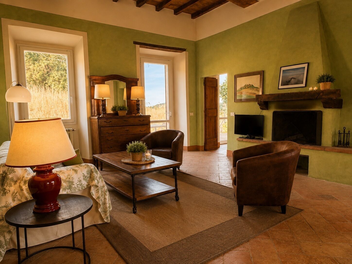 A cozy living room with a fireplace, comfortable seating, and a television.