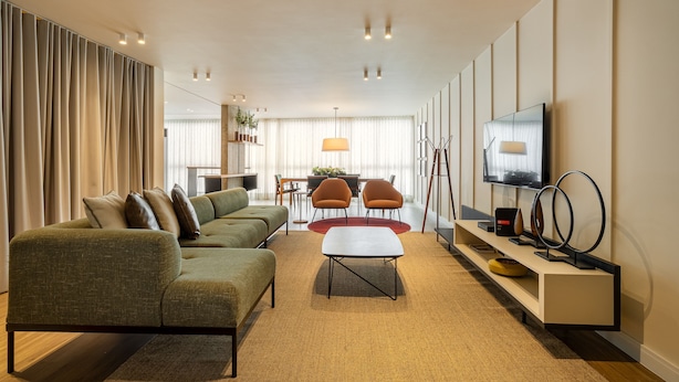 A modern living room with a sofa, coffee table, and TV stand. - Mercurio by Bhomy (São Paulo)