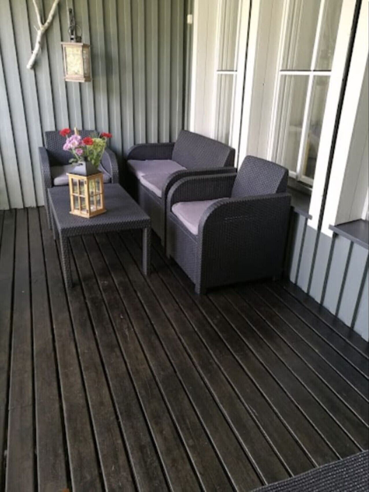 Furnished terrace with comfortable armchairs for relaxing outdoors.
