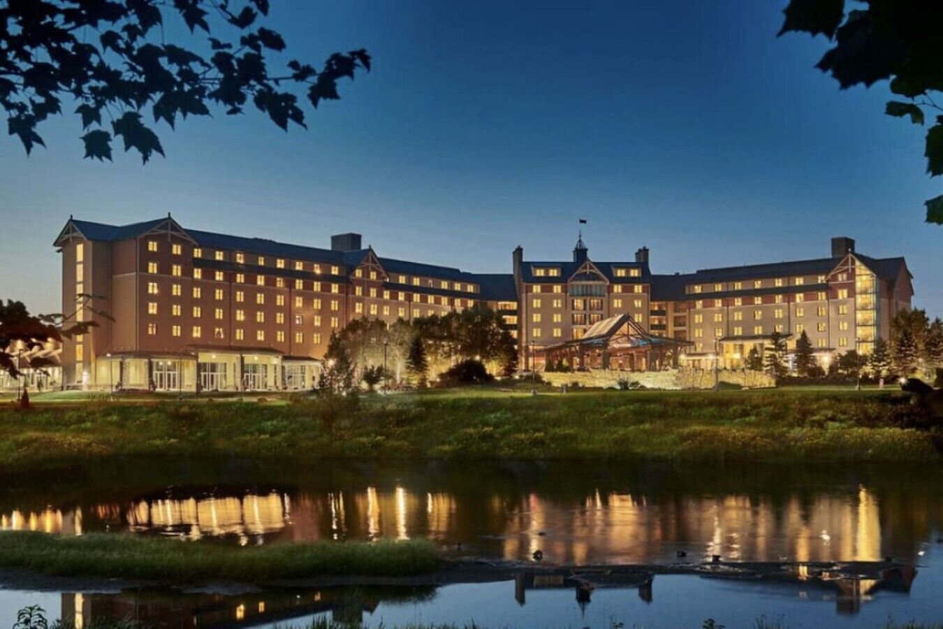 A large hotel with multiple floors and a prominent central building.