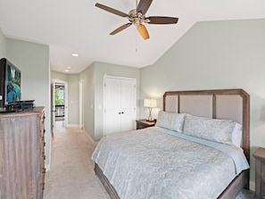A bedroom with a bed, a ceiling fan, a nightstand, and a dresser. - Wintergreens R332- Mtn Condo/View, Gated Resort, Indoor/Outdoor Pools & Hot Tub (Banner Elk)