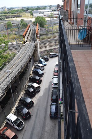 A multi-level parking structure with several cars parked on different levels. - In a quiet neighborhood not far from downtown and very close to the subway and bus stops (Bari)