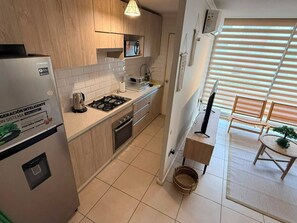 Private kitchen - Just a short walk from the shopping center—ideal for families, couples, or business trips. (Linares)
