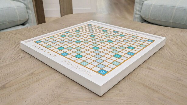 A Scrabble game board on a wooden table. - Beacon: 30A beaches, sleeps 26, private pool! (Santa Rosa Beach)
