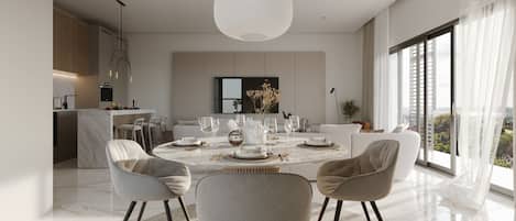 Un comedor moderno con una mesa redonda, sillas y vistas de la ciudad a través de grandes ventanales.