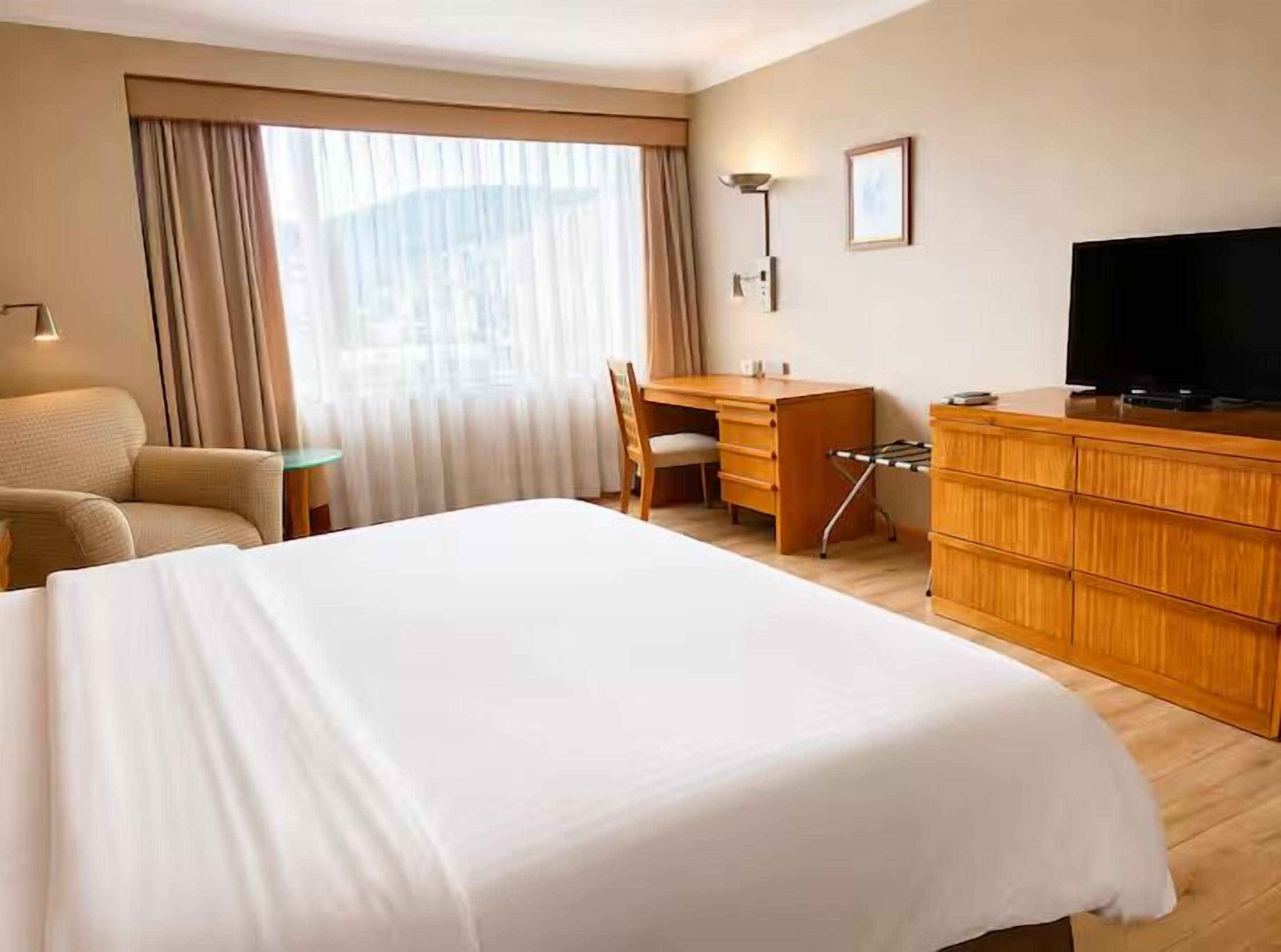 Family Apartment, City View | In-room safe, desk, laptop workspace, blackout drapes