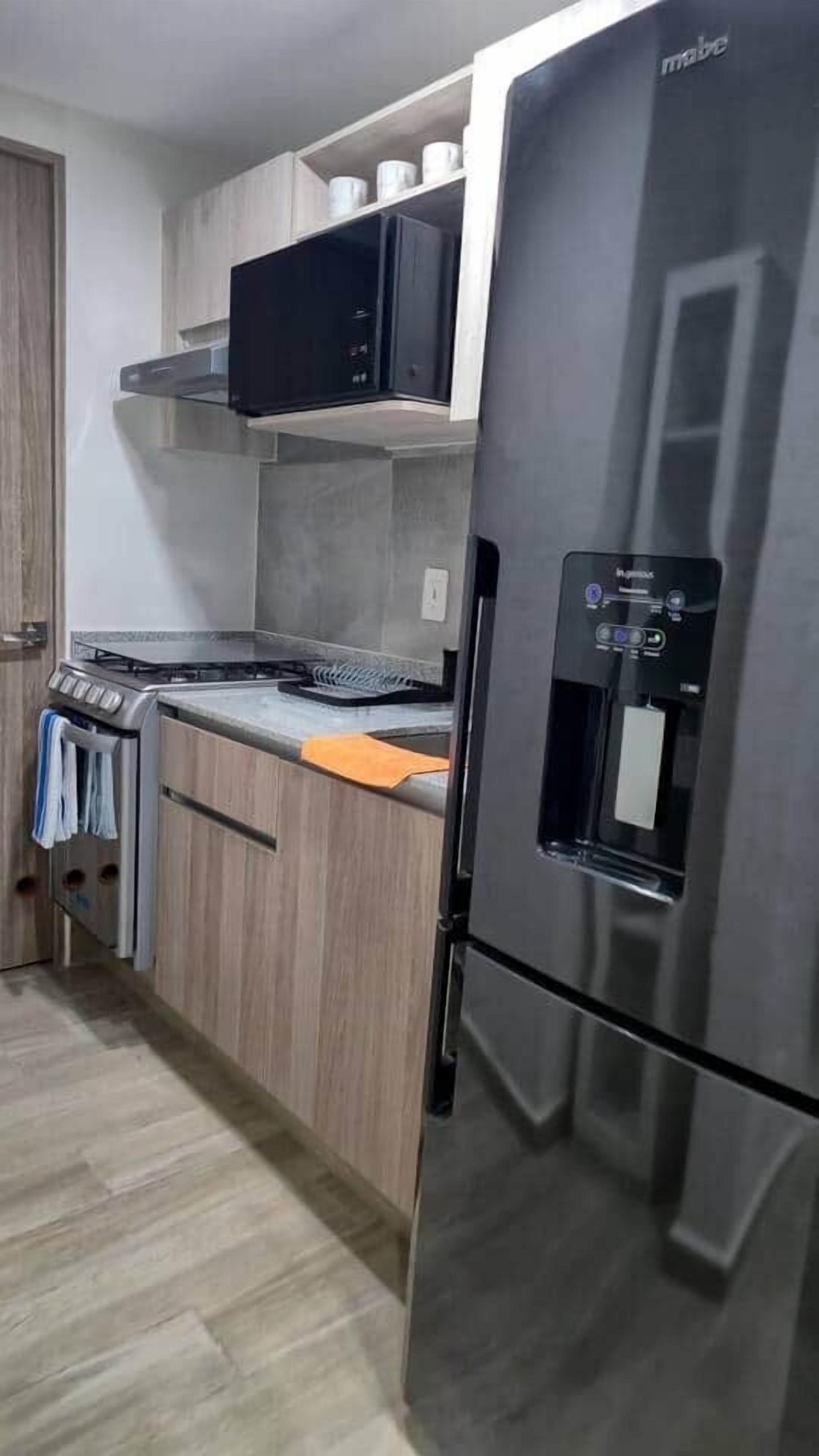 Coffee/tea maker, fridge, microwave, oven