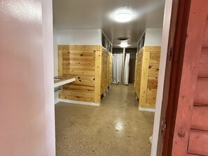 A corridor with wooden bunk beds and a ceiling light. - Unique Glamping tent with 2 twin beds in Sturgis South Dakota (Sturgis)
