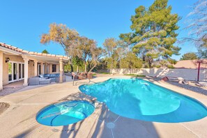 A backyard with a swimming pool, outdoor seating, and a pergola. - Serenity Stay in Henderson with Pool! (Henderson)