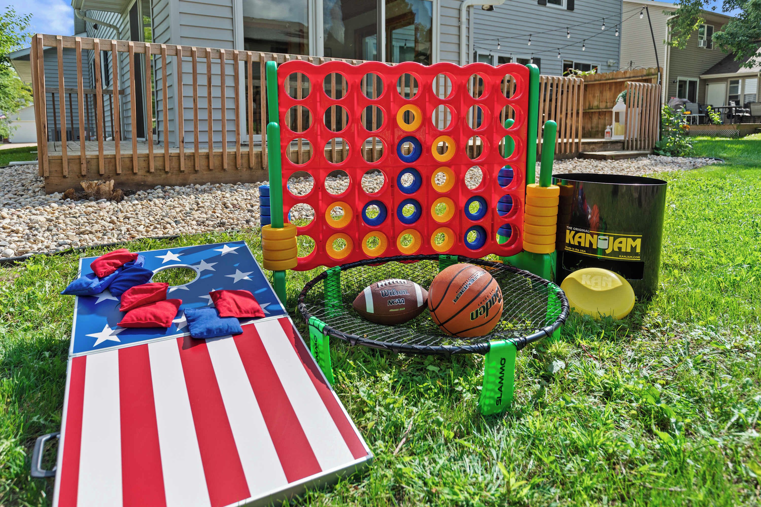 A sports-themed outdoor play area with a basketball hoop, a jump rope, and a colorful obstacle course.