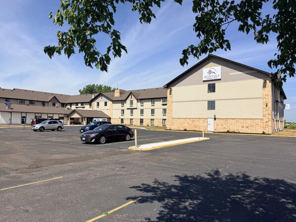 A parking lot with a building labeled 'Roseville Budget Inn' in the background.