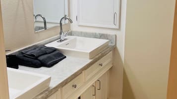 Shower, towels, soap, toilet paper