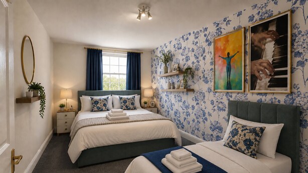 A hotel room with two beds, a large window with curtains, a floral wallpaper, and a painting on the wall.