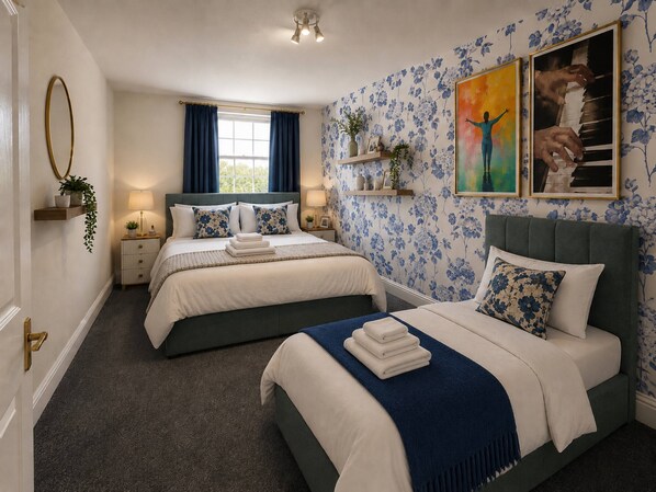 A hotel room with two beds, a large window with curtains, a floral wallpaper, and a painting on the wall.