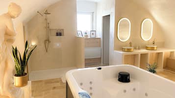 Shower, jetted tub, towels, soap