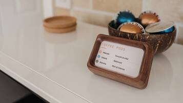 A coffee pod holder with labels for different types of coffee pods.