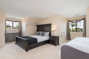 A bedroom with a large bed, a nightstand, a dresser, and a window with curtains. - Spacious 5-bedroom in Temecula Wine Country w/Pool/Spa/Fire pit/View (Temecula)