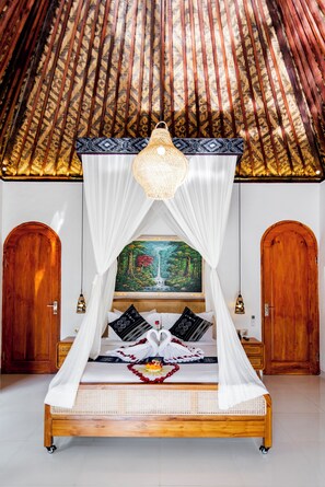 A room with a bed, a canopy, a painting, and a ceiling with a woven pattern.