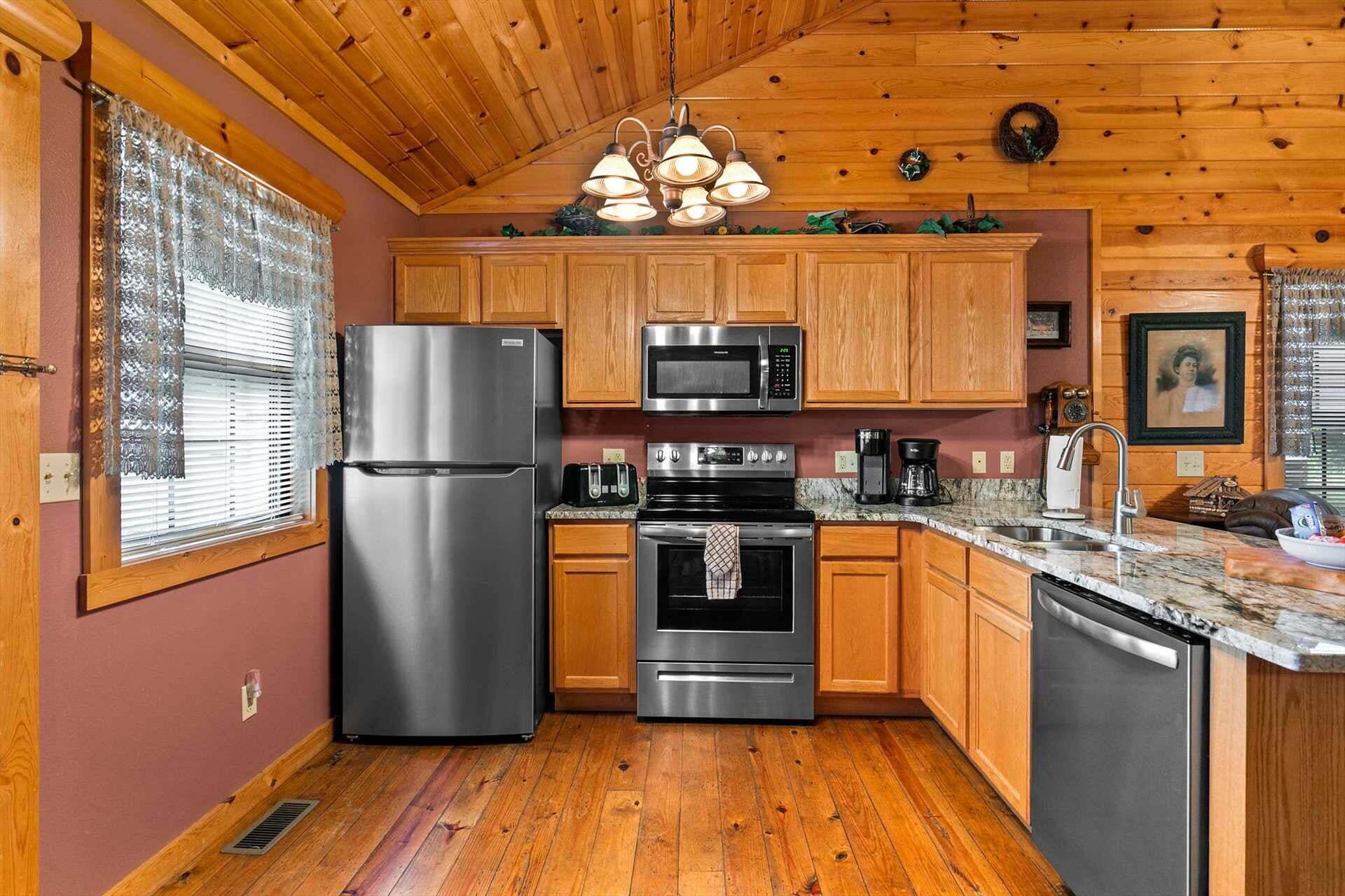 A kitchen with wooden cabinets, stainless steel appliances, a granite countertop, and a window with blinds.